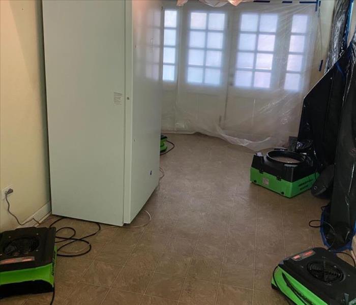 SERVPRO equipmnt is used to help dry a water damaged room. 