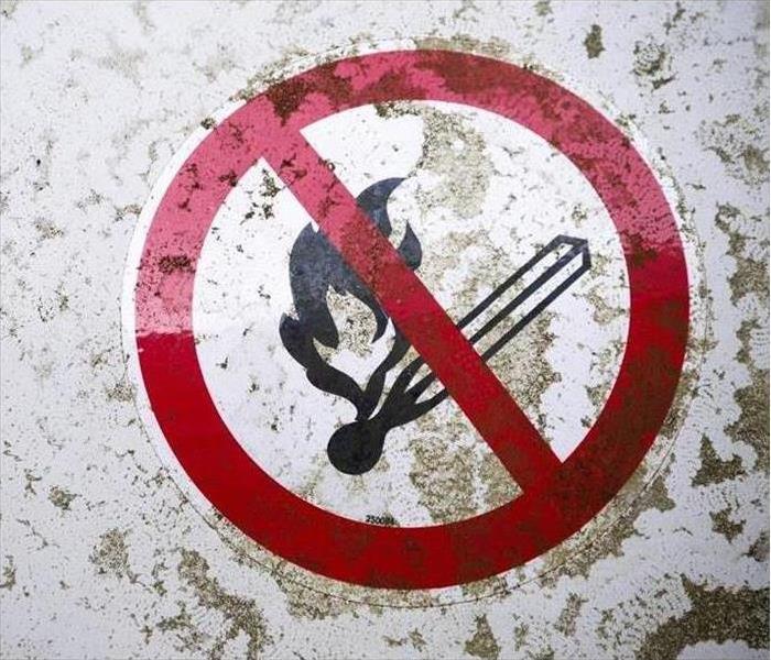 Image of a sign that indicates that matches on fire are not allowed. 