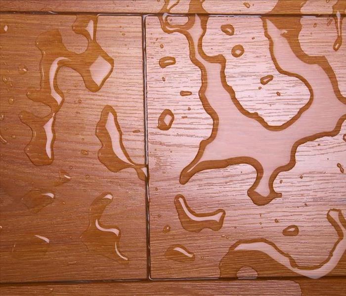 Image of tiled floor with standing water